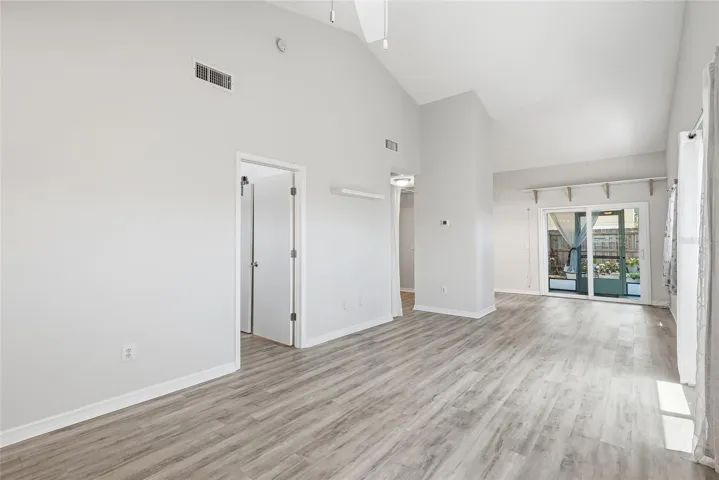 stunning high ceilings, consistent updated flooring throughout the entire unit and hurricane impact sliders and windows make this a truly updated home!