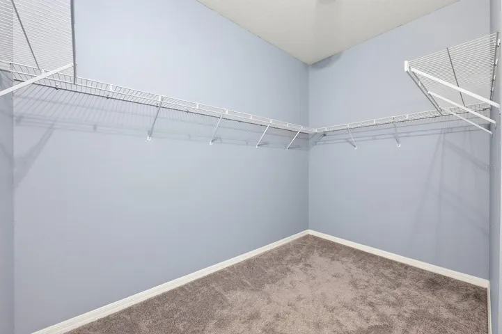 Primary suite walk-in closet.