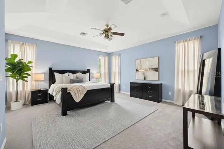 Spacious primary suite becomes your tranquil retreat. Virtually Staged.