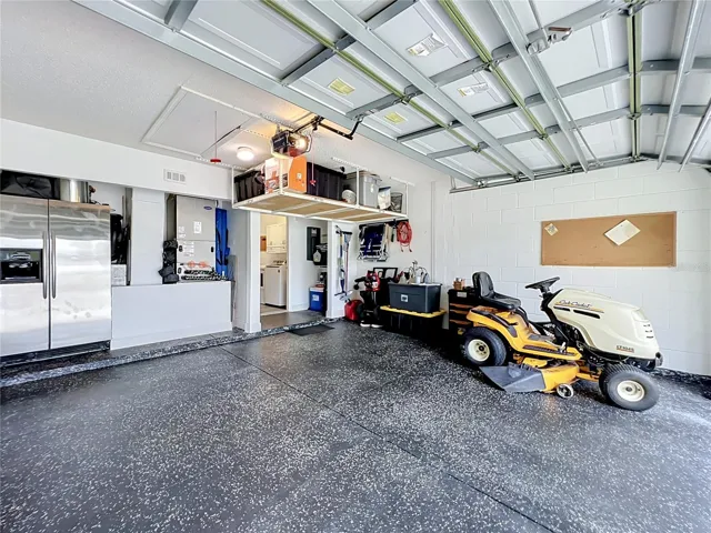 2 car garage with fridge, storage and Epoxy floors