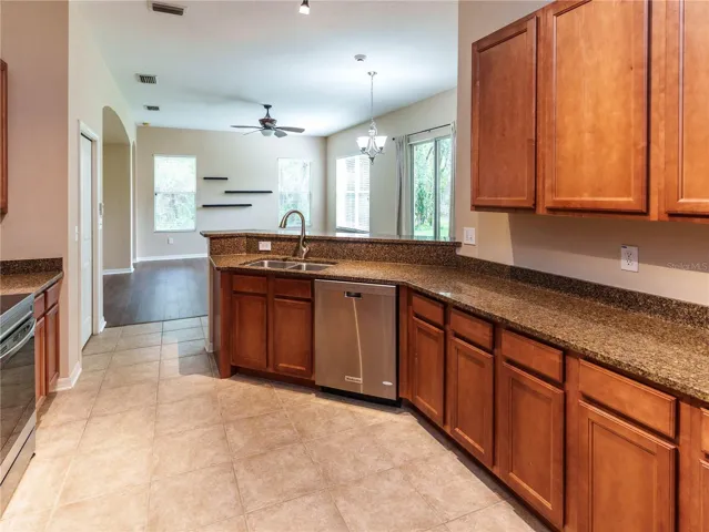 Beautiful Kitchen with wood cabinets & solid surface counters