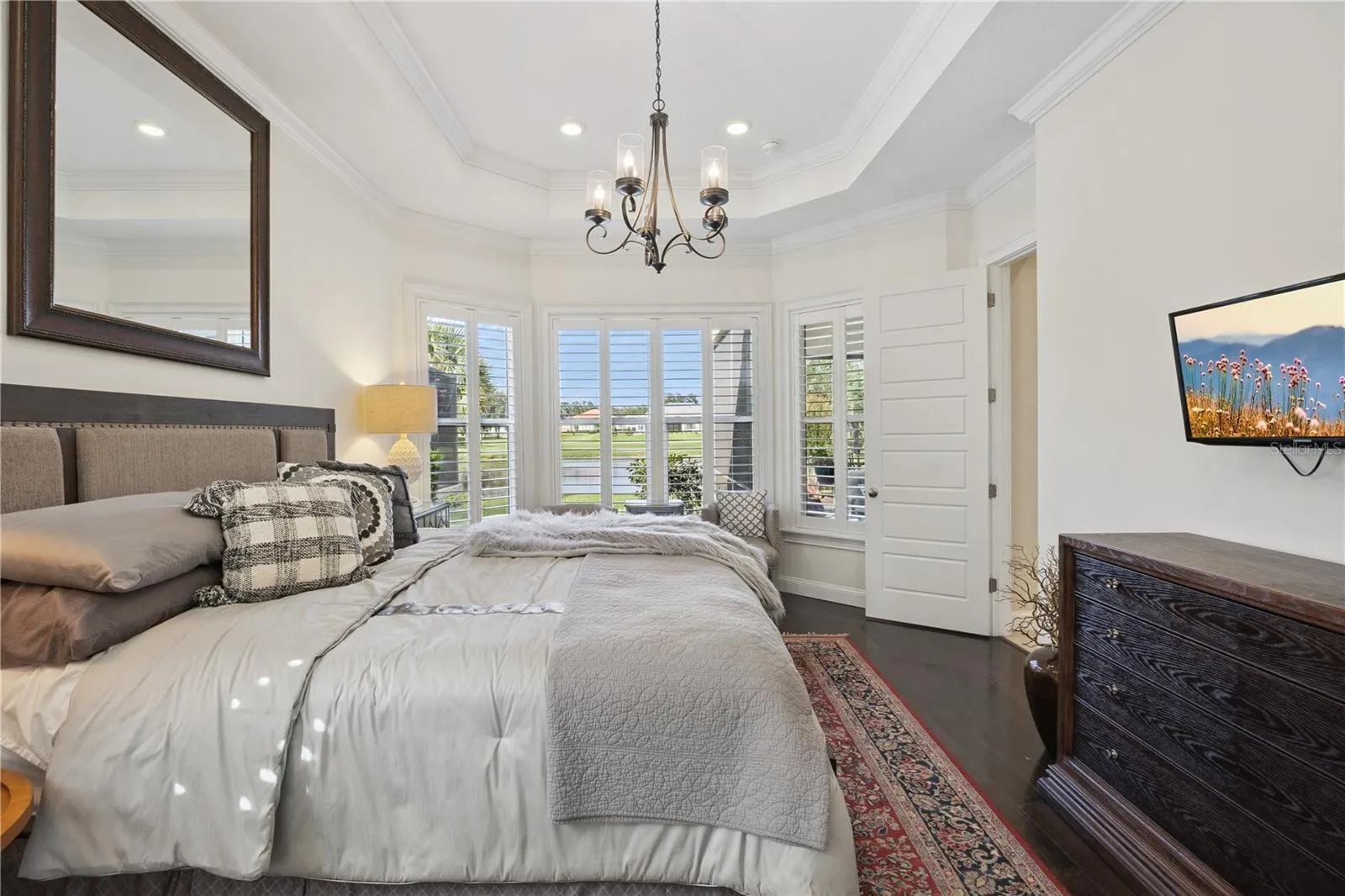Stunning Master bedroom with views of the pond.