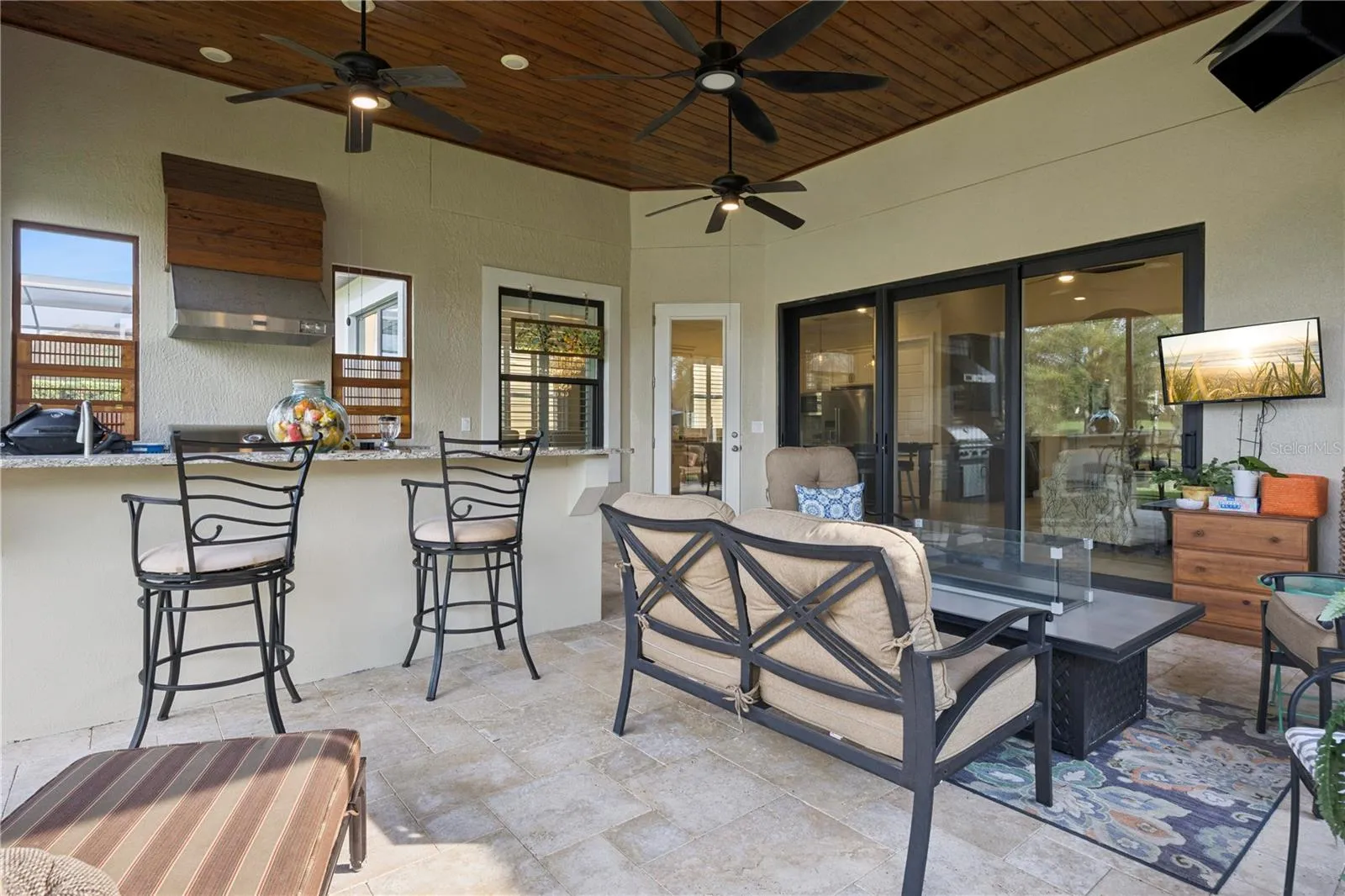 Inviting Summer Kitchen with gas grill.