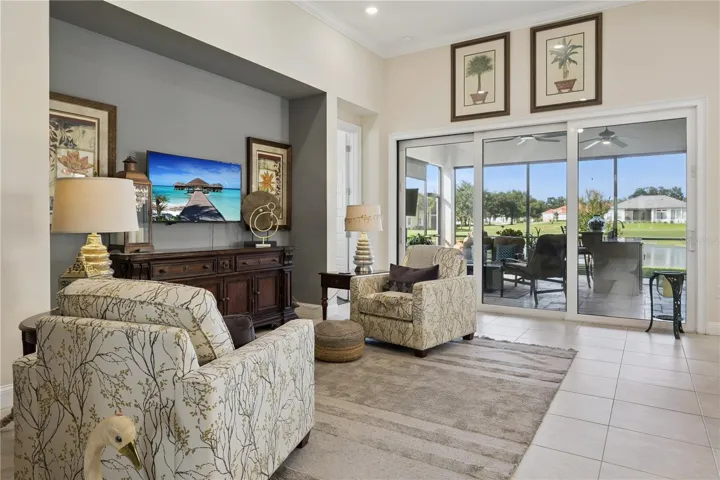Open living room with sliding doors to Summer Kitchen