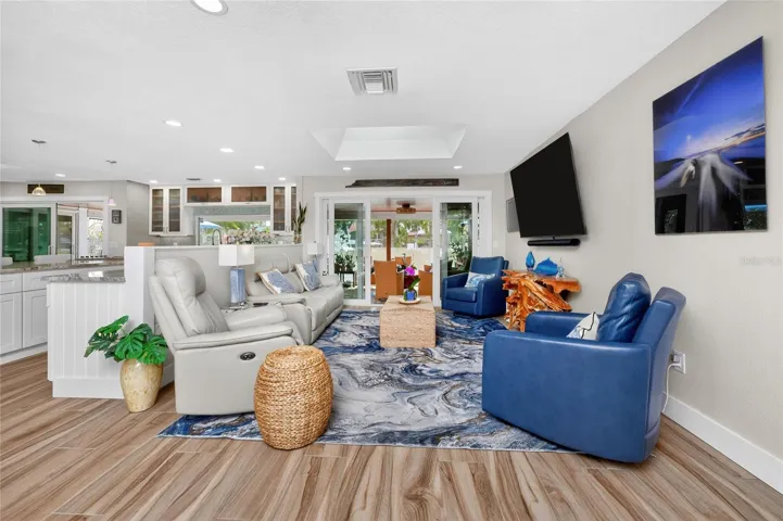 Flowing room to room, wood-plank porcelain tile flooring ties the whole open concept together - A stunning blend of hardwood character and durability.