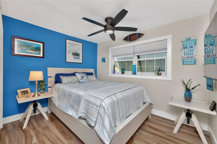 This  coastal vibe is carried throughout the guest bedrooms with exterior bahama shutter for privacy