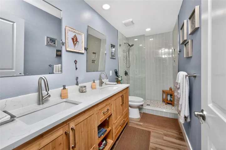 This redesigned second bathroom pairs contemporary style with everyday luxury - Bamboo Vanity with Quartz Counters