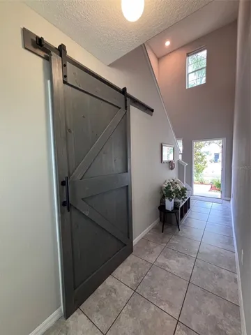 Barn door to half-bath downstairs