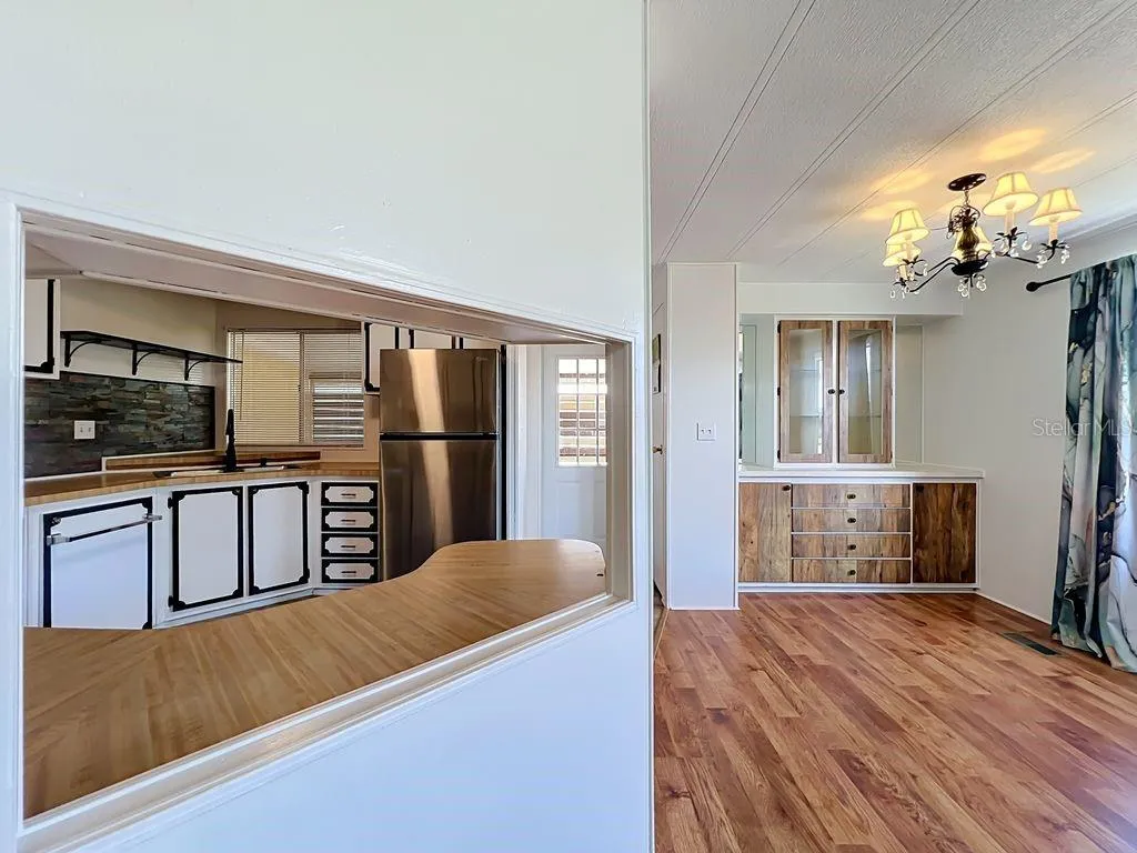 Kitchen pass through and dining area