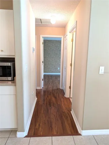 Hallway to 2nd and 3rd bedrooms and 2nd bath