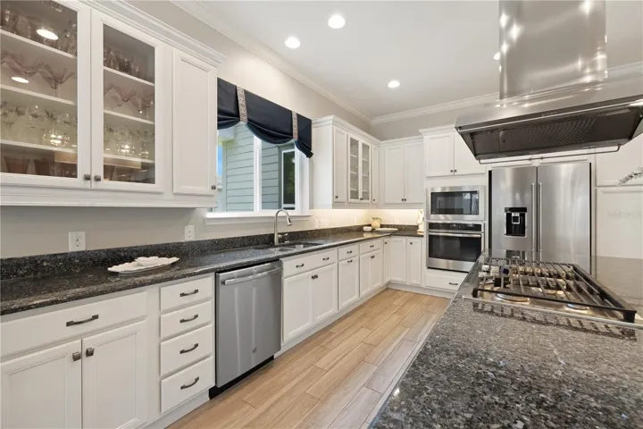 Granite countertops and glass cabinets doors