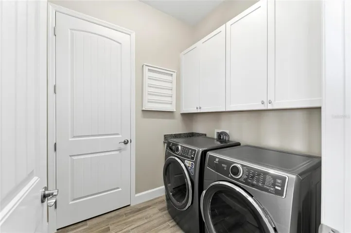 Utiliy room with newer Electrolux washer and dryer
