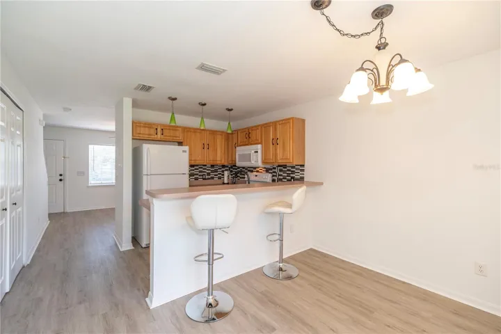 VIEWS OF THE HALLWAY LEADING TO LIVING ROOM