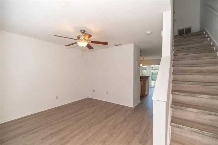 LIVING ROOM AND STAIRWELL TO LEVEL TWO