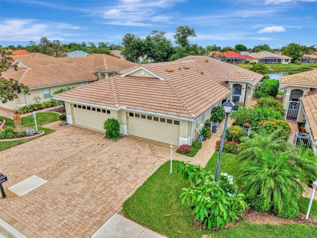 Beautiful Villa on Pond, with Brick Pavers, Brand New Barrell Tile Roof!