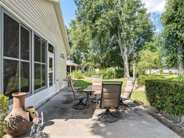 Just outside covered lanai is an open area porch for grilling and relaxing.