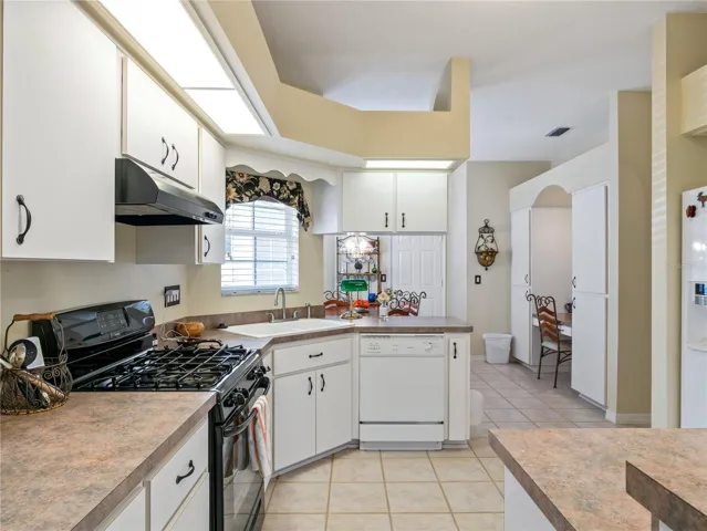 Kitchen includes breakfast nook and built-in desk.
