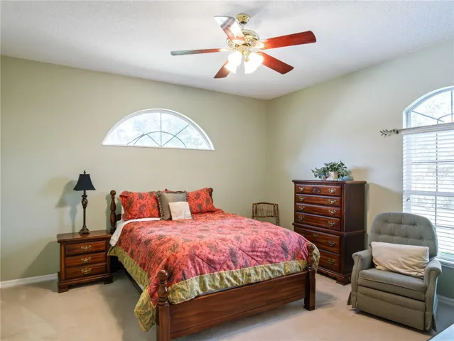 Primary bedroom with views out back.
