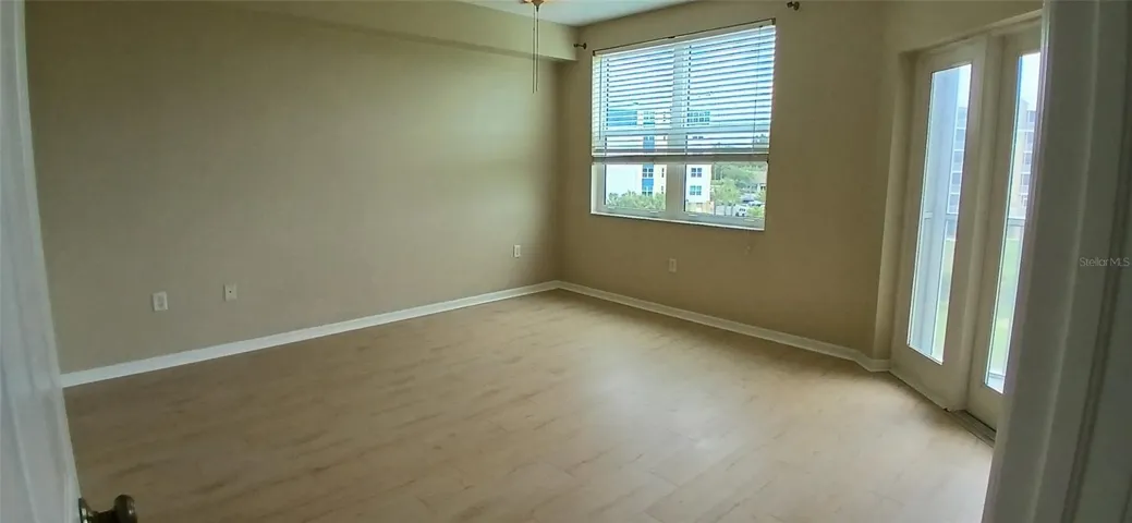 Primary bedroom with access to the screened in Balcony