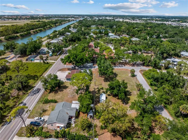Same photo without lines. Photo taken from Southern lot line showing Intracoastal, south bridge to the Island of Venice, and shopping district in background