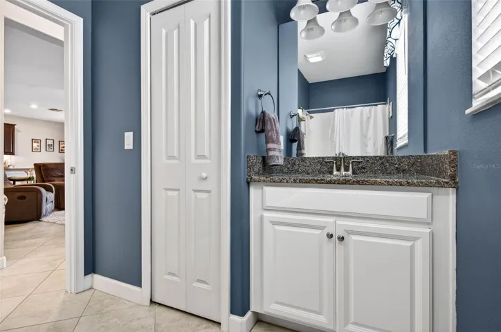 Downstairs bathroom vanity and linen closet