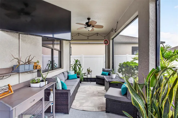 Screened lanai, under cover, with ceiling fans and outlets.
