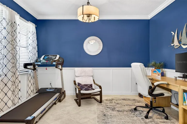 Decorative walls add dimension to the office/dining area