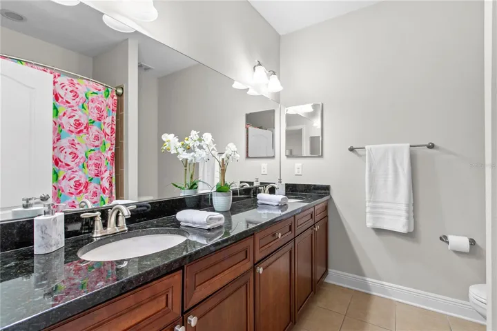 Additional full bathroom with dual vanities