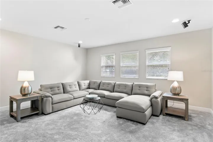 Oversized bonus room that can easily adapt to your lifestyle as a media room, playroom, fitness studio, home office, or game room.