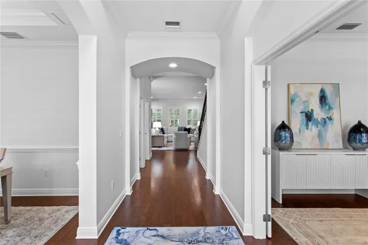 A grand entry with soaring ceilings sets the tone for the home