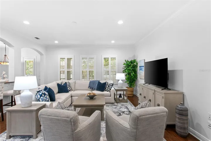 The generously sized family room offers a comfortable gathering space