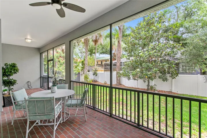 Enjoy direct access to the screened back porch from the spacious first-floor primary suite