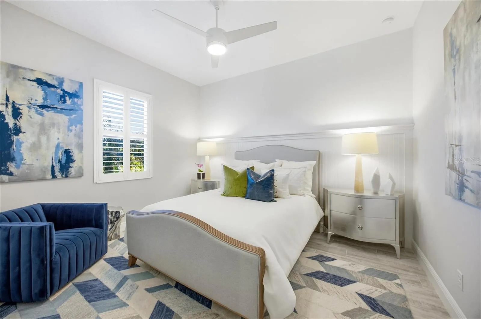 Guest Bedroom 2 has Shiplap, Plantation Shutters and Ceiling Fan