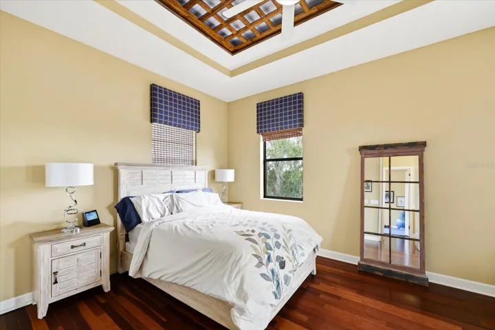 2nd level guest bedroom with doors out to large balcony