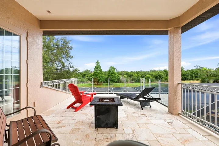 Relax on the extra large balcony with upgraded glass railings overlooking the lake and preserve. Perfect spot for your morning coffee