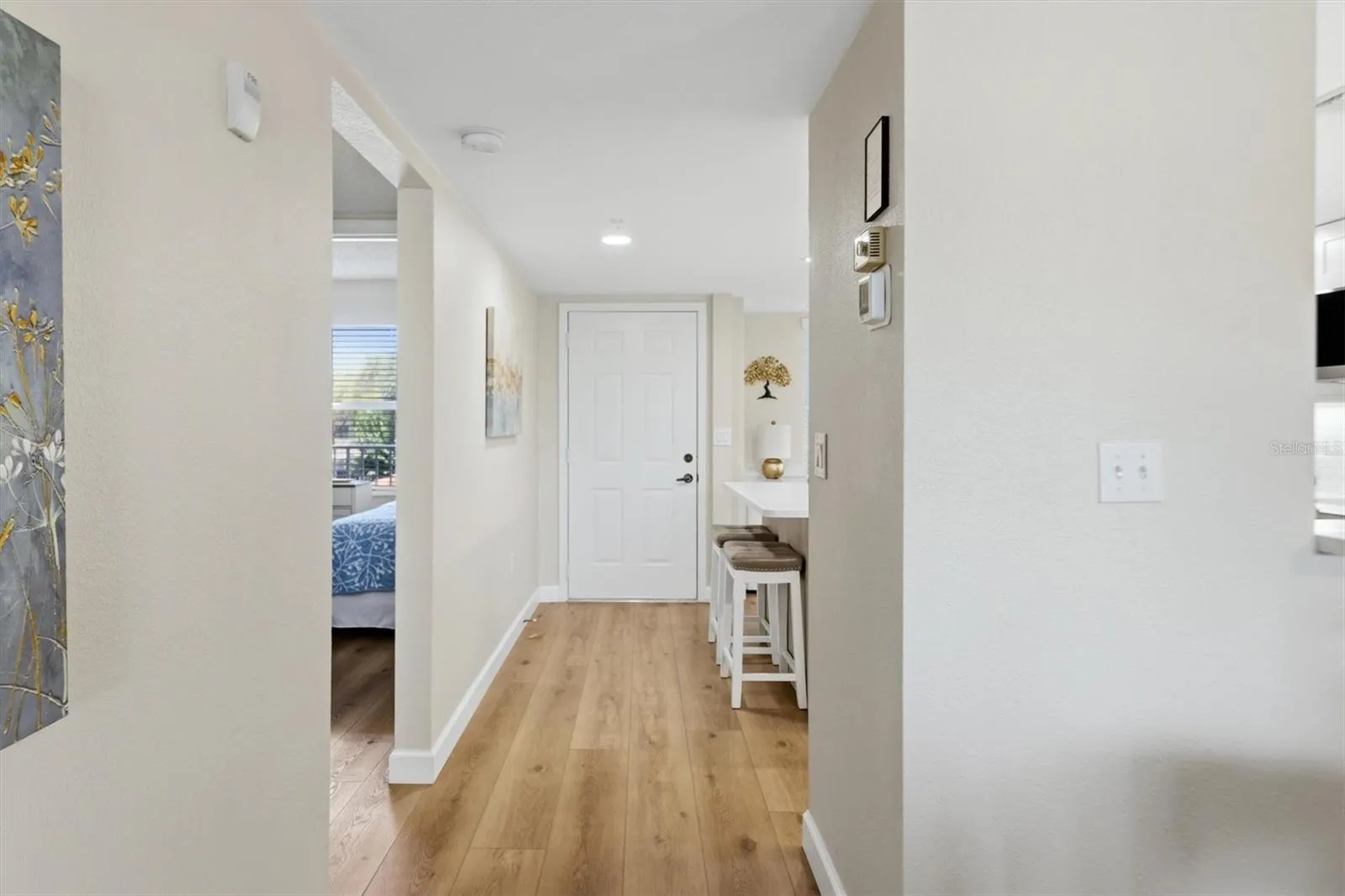Looking towards entry door in kitchen