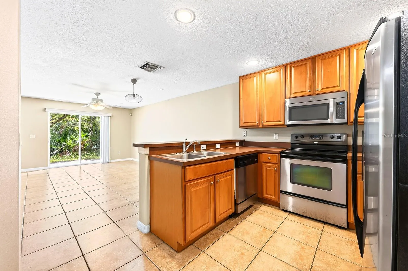 Kitchen is open to the living and dining areas.