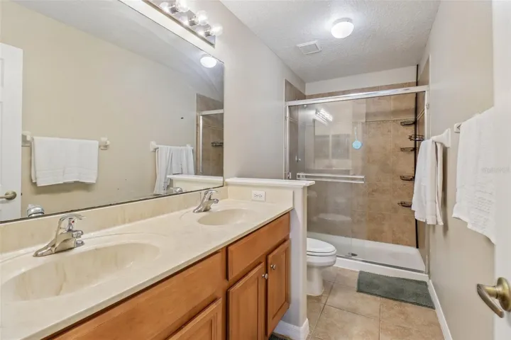 En-suite primary bathroom with walk-in shower