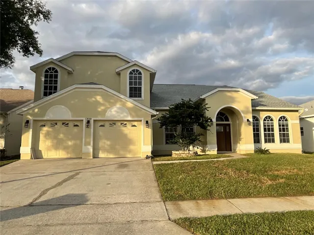 Front of 5 bedroom, 2.5 bathroom plus an office, 2 -car garage. POOL and Pond frontage