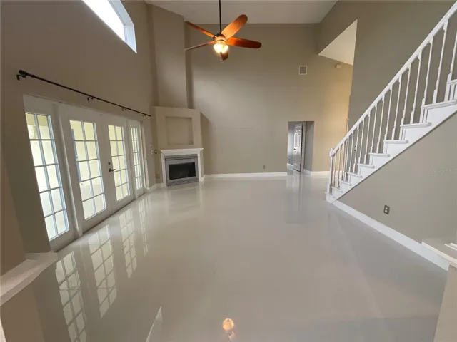 Family Room with gas fireplace and high ceilings