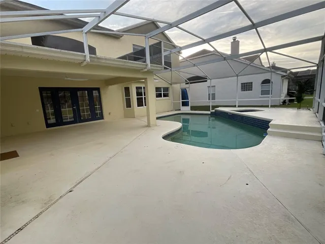 Screened Pool Deck with Pool, Hot Tub and plenty of space for outdoor furniture