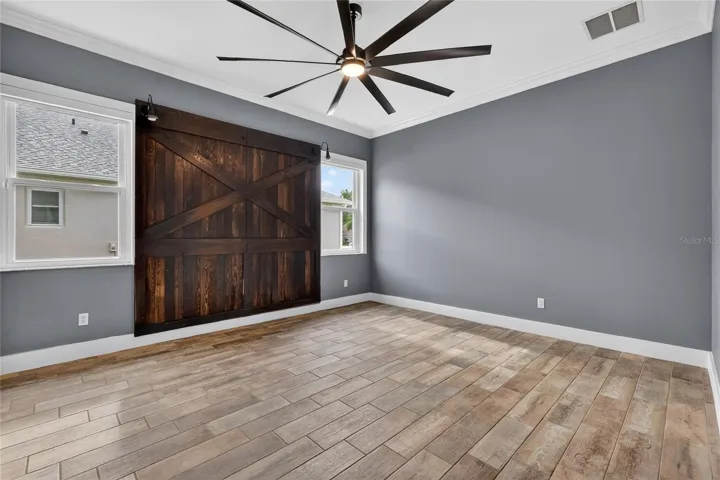 Primary suite with accent feature wall ~
