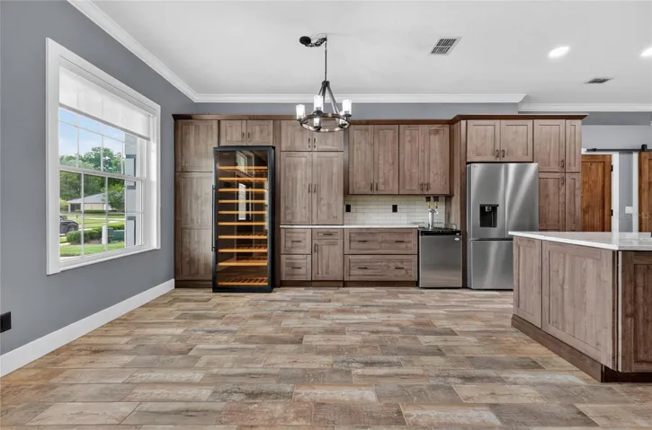 Open concept, dining, wine refrigeration, and kegerator for entertaining ~