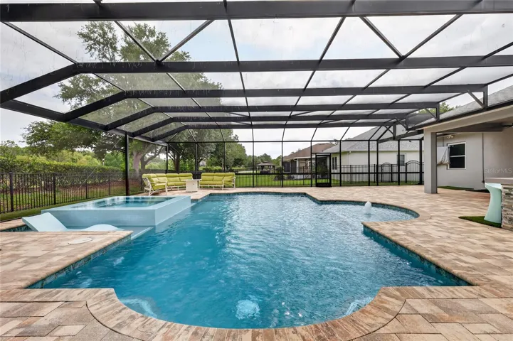Pool is 16' x 34' with glow in the dark toe tile for evening swims ~