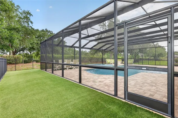 Pool enclosure has doors on each side to access the play areas ~