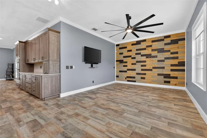 Upgraded remote controlled fan and light, accent wall adds interest to the space ~