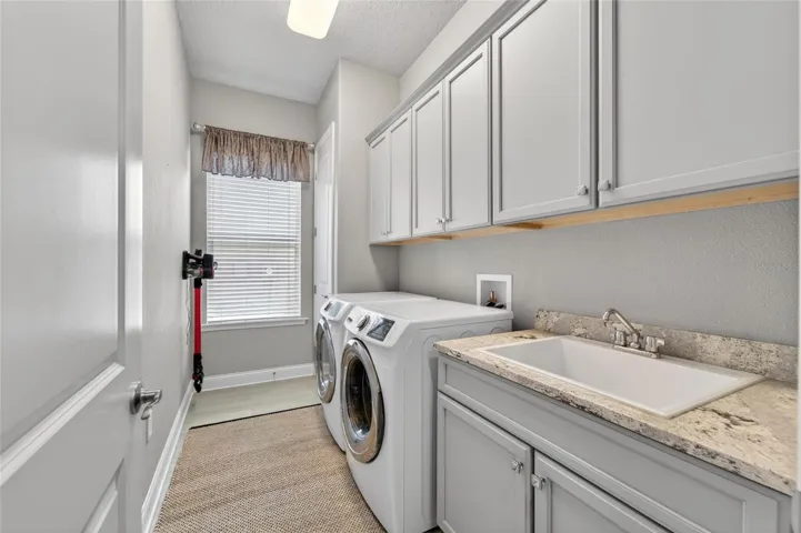 Laundry room with washer and dryer stays
