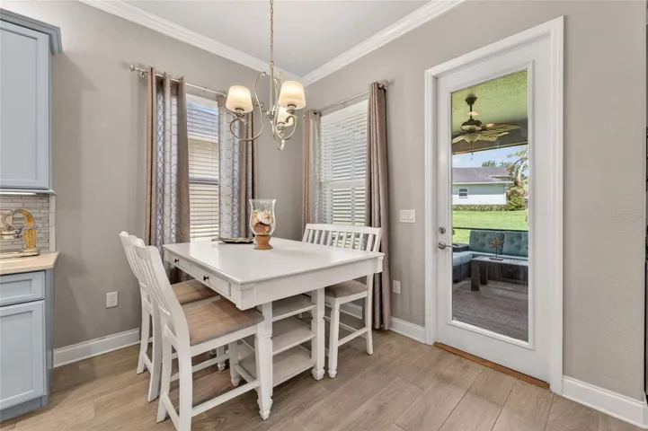 Glass Door from eat in kitchen area to screened in lanai
