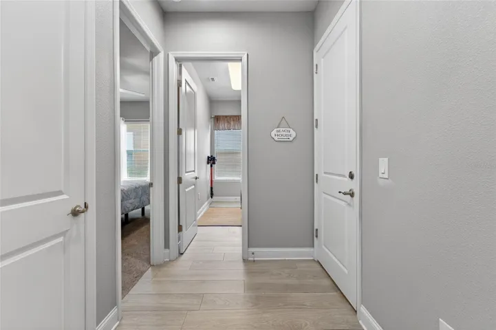 Hallway to guest bedroom and laundry room