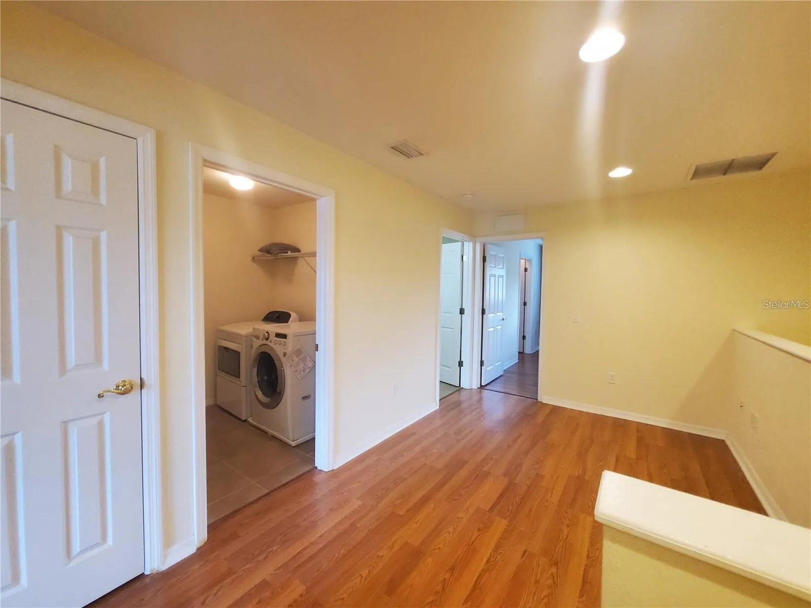 Upstairs bonus area and laundry entrance
